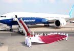New Boeing B777-9 jet flies to Doha International Airport.