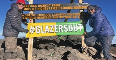 Manchester United fans troll club owners from the rooftop of Africa