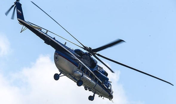 Pilot killed when helicopter hits power line, crashes into river in Russia