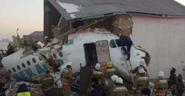 Passenger jet with 100 people crashed into a two story building