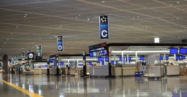 Tokyo Narita Airport quarantines arriving passenger in a cardboard box