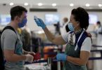 US airlines pledge refunds for passengers denied boarding by airport temperature checks