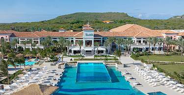 Dos Awa Infinity Pool at Sandals Royal Curacao with expansive upper and lower decks overlooking the Spanish Water and the rugged mountain landscape | eTurboNews | eTN