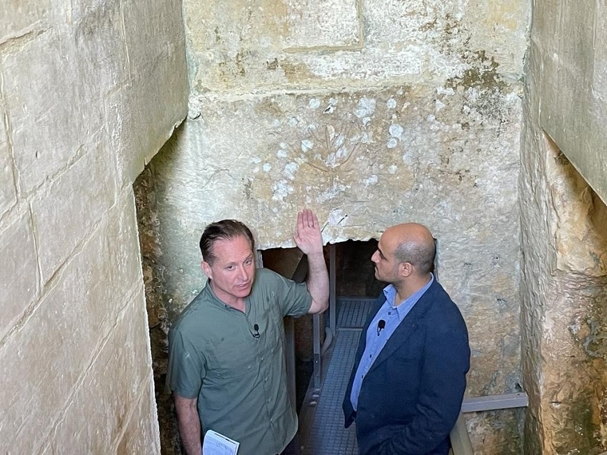 3 MALTA JLTV Host Producer Brad Pomerance left and Dennis Mizzi Ph.D. Judaic Studies University of Malta right explore the Jewish Catacombs in Mdina dating back to 4th 5th century CE | eTurboNews | eTN