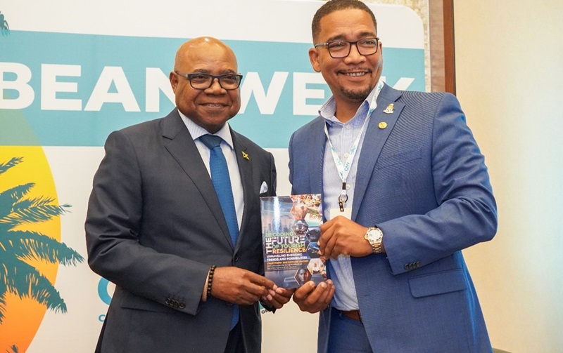 Minister of Tourism, Hon Edmund Bartlett (L) presented his latest book, “Decoding the Future of Tourism Resilience, unravelling emerging trends and possibilities” to CTO Chairman and Minister of Tourism and Ports for the Cayman Islands, Hon Kenneth Bryan, during CTO Caribbean Week held in New York last week.